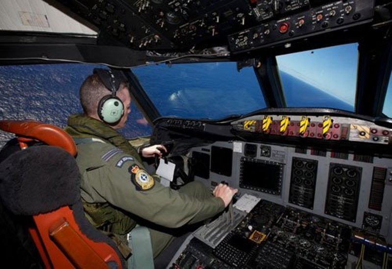 11 April 2014 - Captain Flt. Lt. Tim McAlevey of the Royal New Zealand Air Force while flying a P-3 Orion in search for the missing Malaysia Airlines Flight 370 over the Indian Ocean