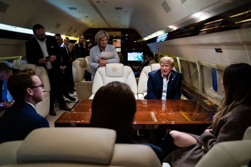 27 April 2023: Susie Wiles and Donald Trump, along with others, during a meeting while flying on his aeroplane known as Trump Force One, after speaking at a campaign event in Manchester