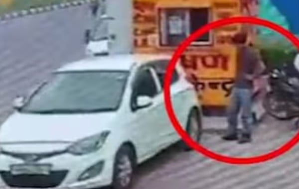 A CCTV picture of the white Hyundai i20 (parked for pollution check) which was used in an explosion near Delhi’s Red Fort