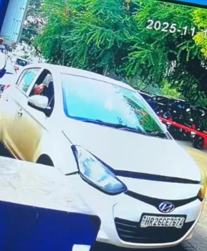 A CCTV picture of the white Hyundai i20 while entering the parking lot