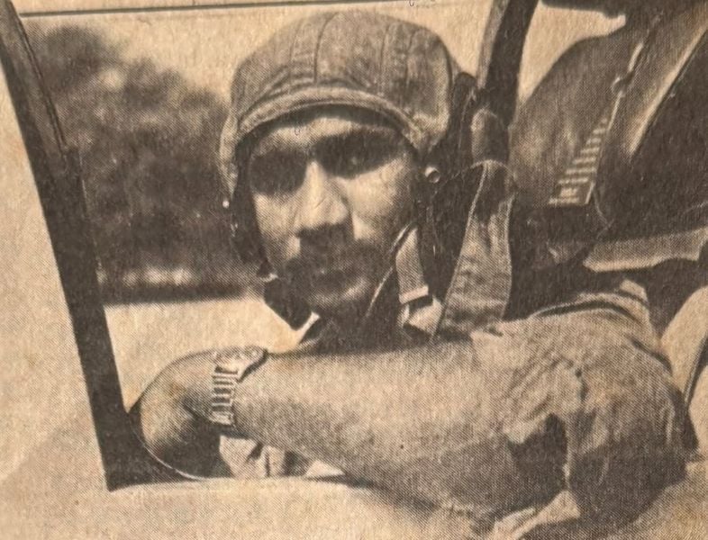 A black and white photo of Squadron Leader Ajjamada B taken while he was seated in the cockpit of a fighter aircraft