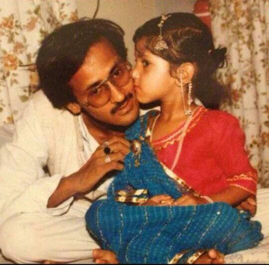 A childhood photo of Aditi Singh with her father
