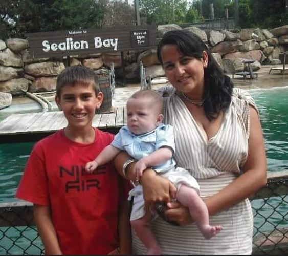 A childhood photo of Jay Vella with his mother and younger brother