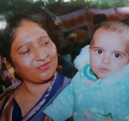 A childhood photo of Kashvee Gautam with her grandmother