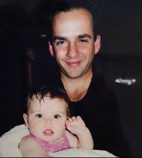 A childhood photo of Kiernan Shipka with her father