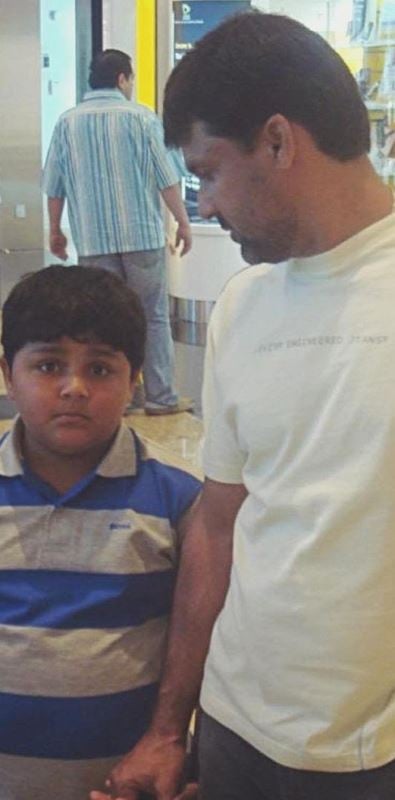 A childhood photograph of Azam Khan with his father