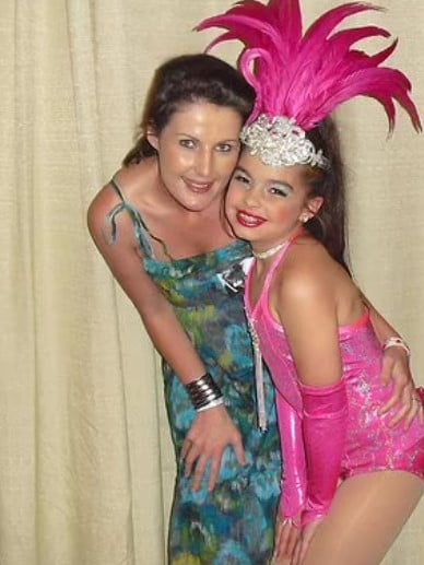 A childhood picture of Addison Rae with her mother after participating in a dance competition