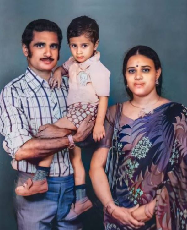 A childhood picture of Adithya Menon with his parents
