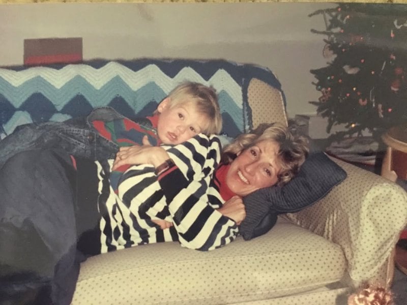 A childhood picture of Austen Kroll with his mother