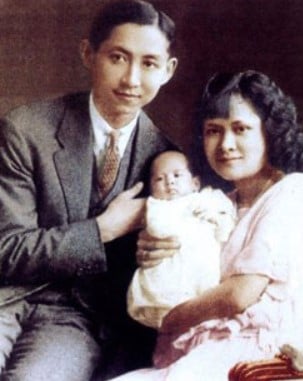 A childhood picture of Bhumibol Adulyadej with his parents