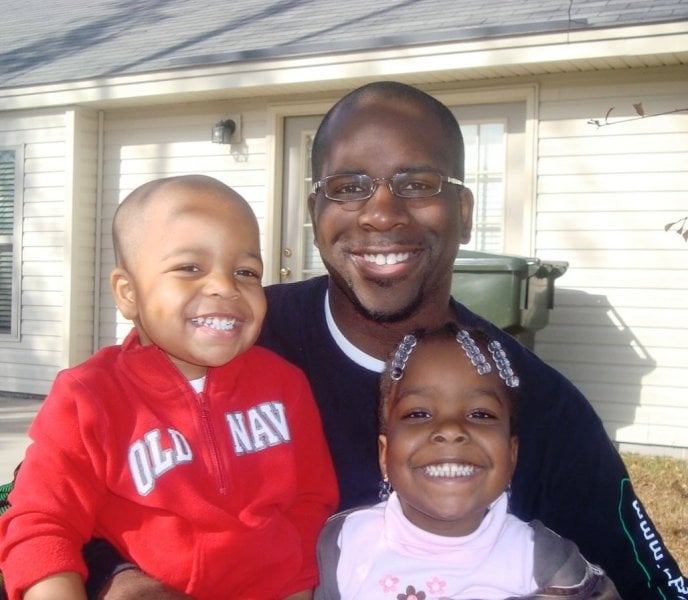 A childhood picture of Elijah M. Cooper and his elder sister, Kayli-Joy Cooper, with their father