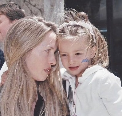 A childhood picture of Eve Jobs with her mother