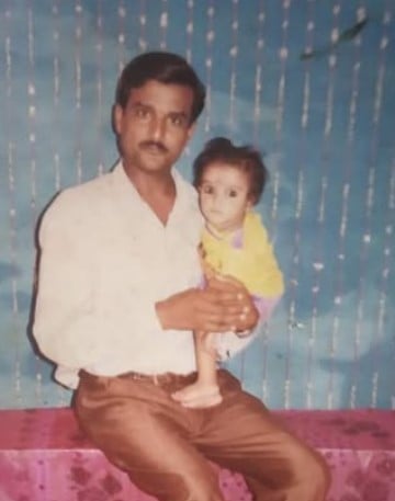 A childhood picture of Jagrati Shukla with her father