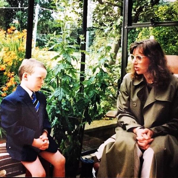 A childhood picture of Richard Madden, along with his mother, captured on his first day of school