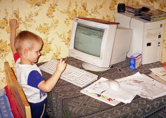 A childhood picture of Vitalik Buterin with a computer