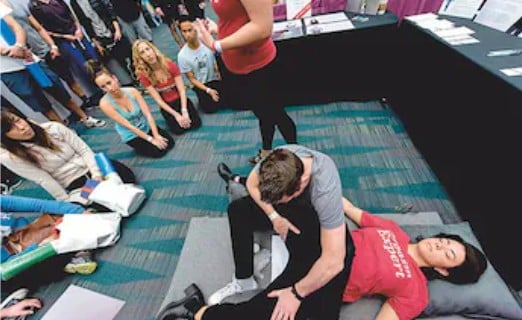 A person while demonstrating OneTaste Orgasmic Meditation