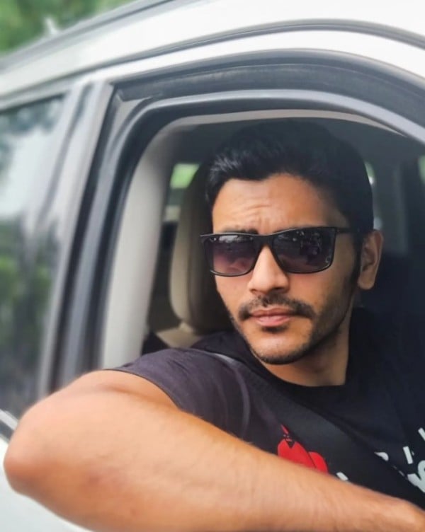 A photo of Arjun Chakrabarty driving a car