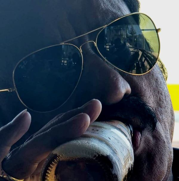 A photo of Avinash Mishra drinking beer