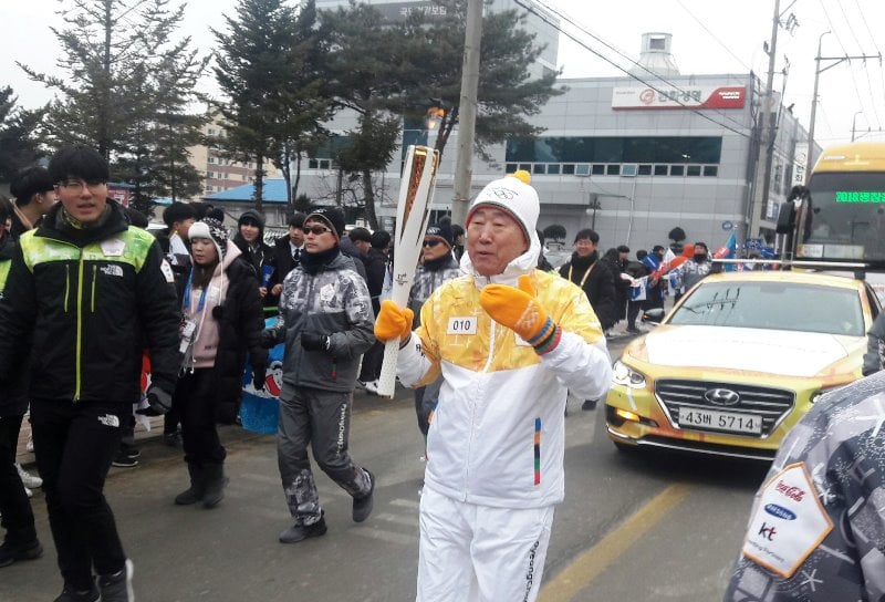 A photo of Ban taken while he was runnig with the Olympic Torch during the opening ceremony of the 2017 Winter Olympics in South Korea