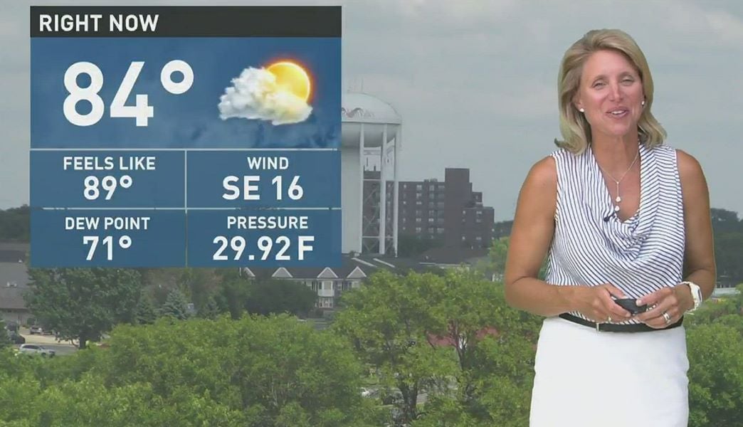 A photo of Belinda Jensen reporting weather news on KARE11