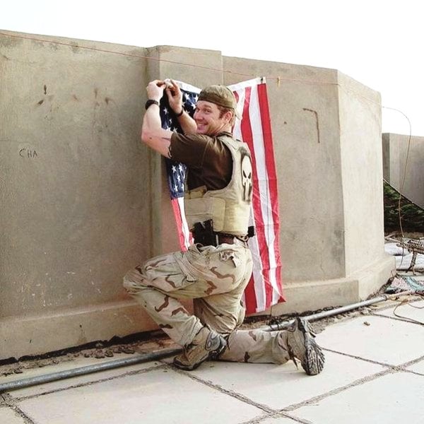 A photo of Chris Kyle taken wearing the bulletproof jacket with the iconic Punisher logo