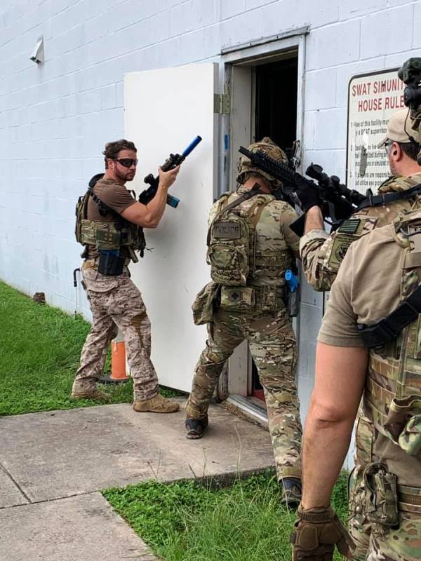 A photo of Dan taken while he was doing a room clearance drill with the Homeland Security Investigations