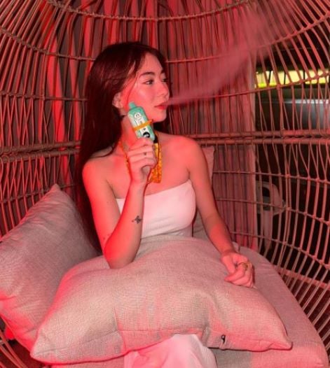 A photo of Fyang Smith smoking vape