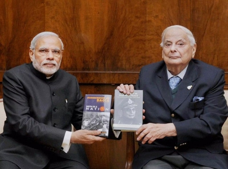 A photo of J. F. R. Jacob and Prime Minister Narendra Modi holding the books that Jacob authored