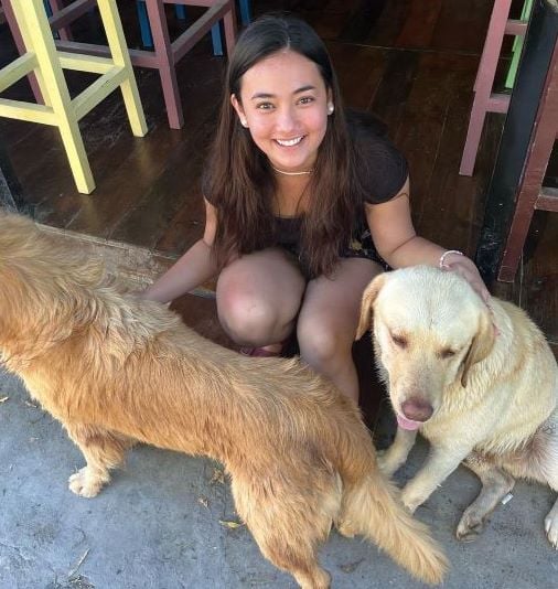 A photo of Jas Dudley-Scales with dogs