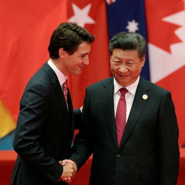 A photo of Justin Trudeau with the Chinese Premiere Xi Jinping