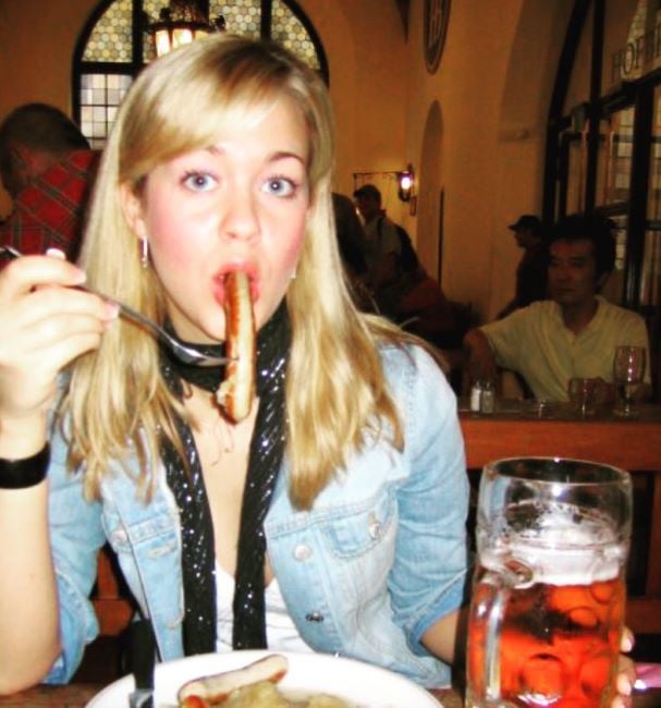 Laura Sanko with a mug of alcohol