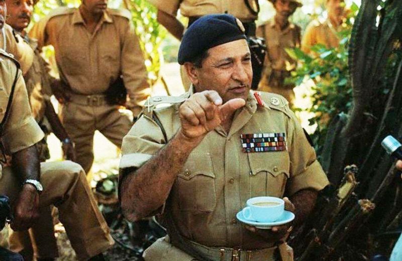 A photo of Lt Gen Niazi sitting with his troops in East Pakistan