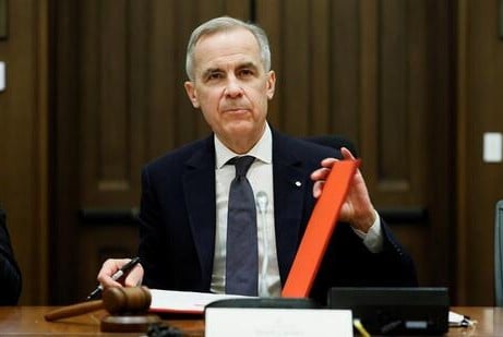 A photo of Mark Carney taken while he was signing an order