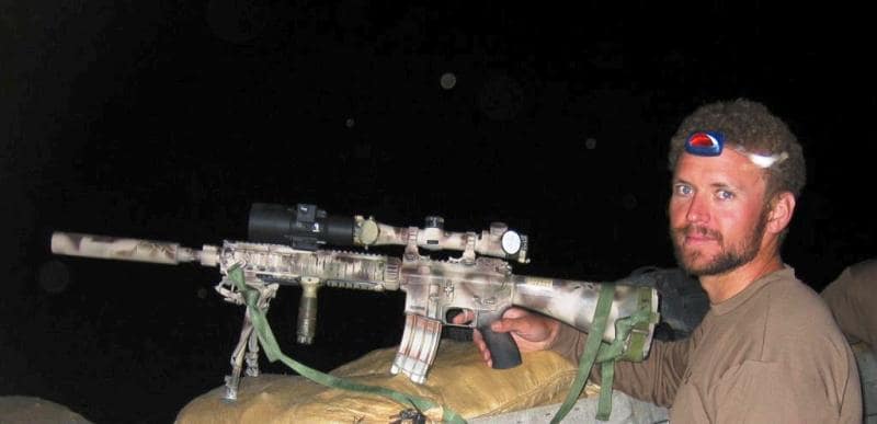 A photo of Matthew taken while he was posing with his sniper rifle