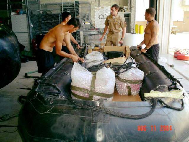 A photo of Michael (in the centre) taken in 2004 briefing his teammates on a training mission In Hawaii