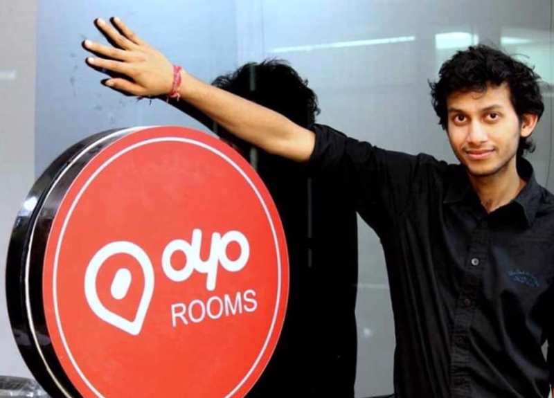A photo of Ritesh Agarwal taken with the OYO Rooms signboard
