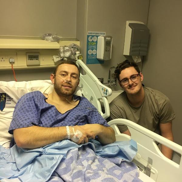 A photo of Ross Adair in the hospital with his brother