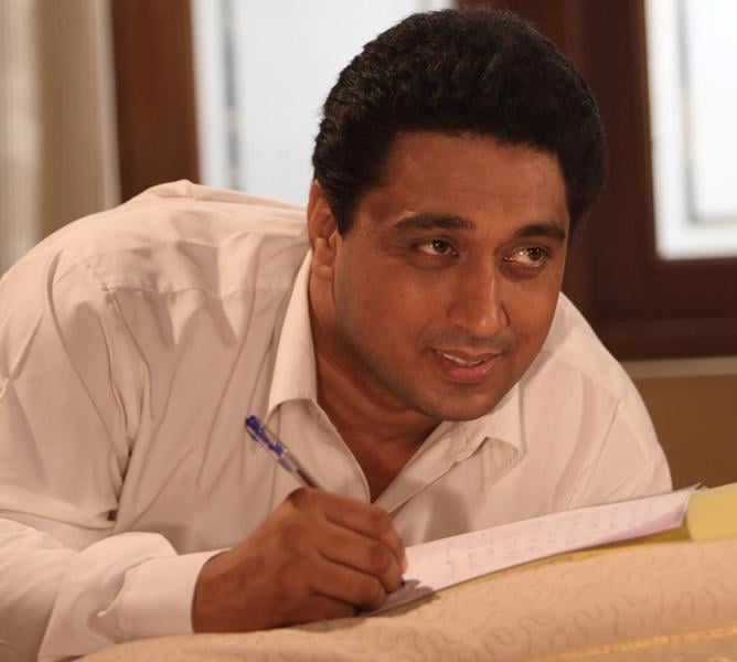 A photo of Smeep Kang writing a story