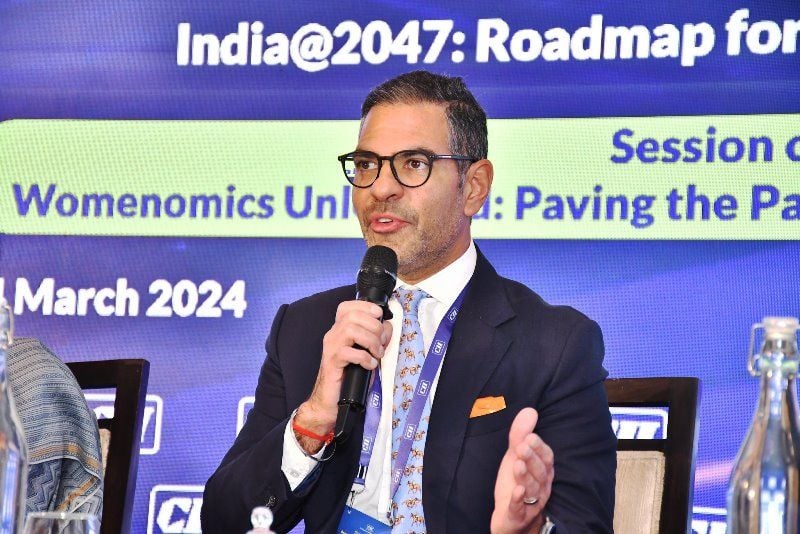 A photo of Sunjay Kapur taken while he was addressing the media during an event