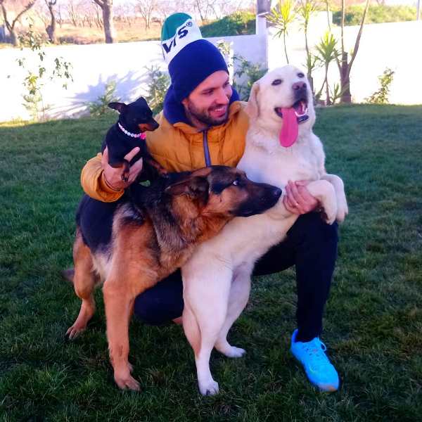 A photo of Tiago Rodrigues with his dogs