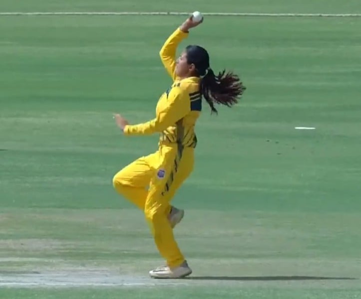 A photo of Utkarsha Pawar bowling in a match