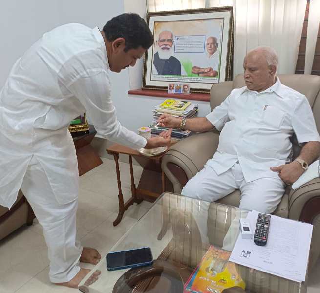 A photograph of B. Y. Vijayendra and B. S. Yediyurappa
