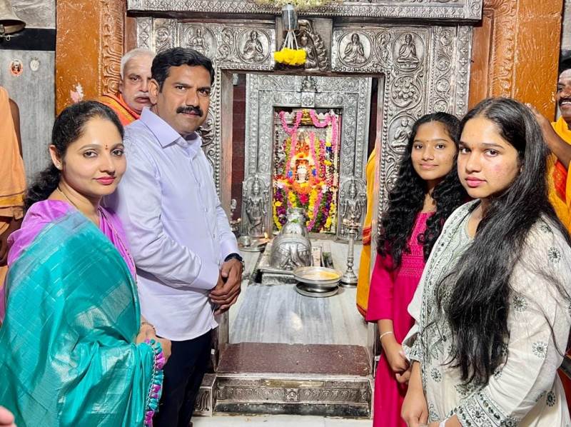 A photograph of B. Y. Vijayendra with his family offering prayers at a temple
