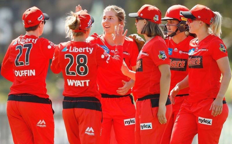 A photograph of Georgia Wareham celebrating with Melbourne Renegades Women teammates