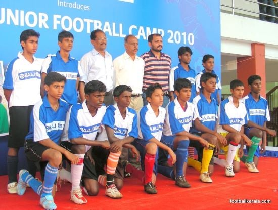 A photograph of Jo Paul Ancheri with youth team players