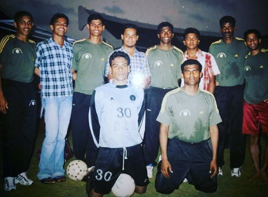 A photograph of Pappachen Pradeep (second row, fourth from right) with the State Bank of Travancore football club
