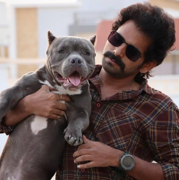 A photograph of Sadda M Hussain with his pet dog, Gabbar