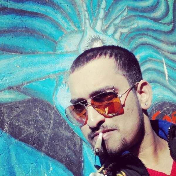 A picture of Abhay Chintamani Mishr smoking a weed