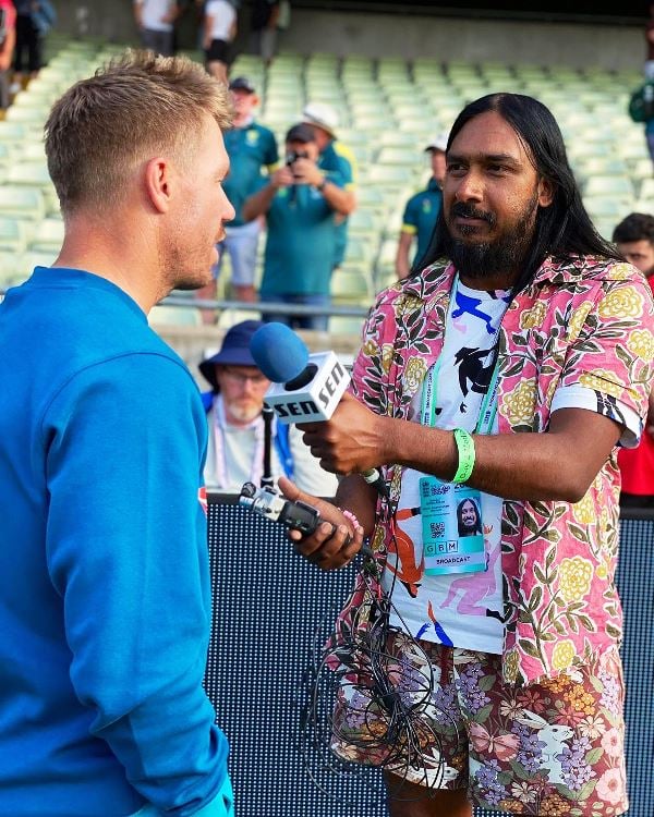 A picture of Bharat Sundaresan interviewing cricketers at The Ashes, 2023