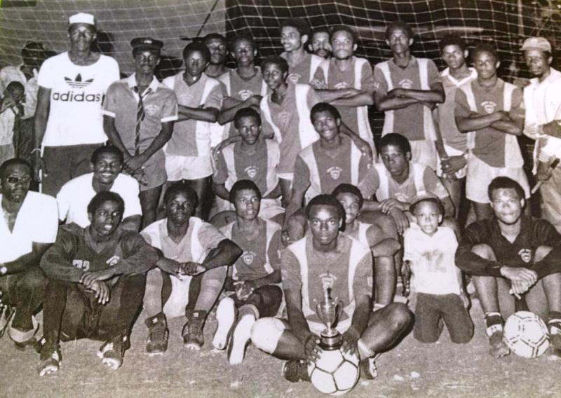 Coach Steve Bucknor (wearing white Adidas T-Shirt) with 1982 Cornwall College DaCosta Cup football team